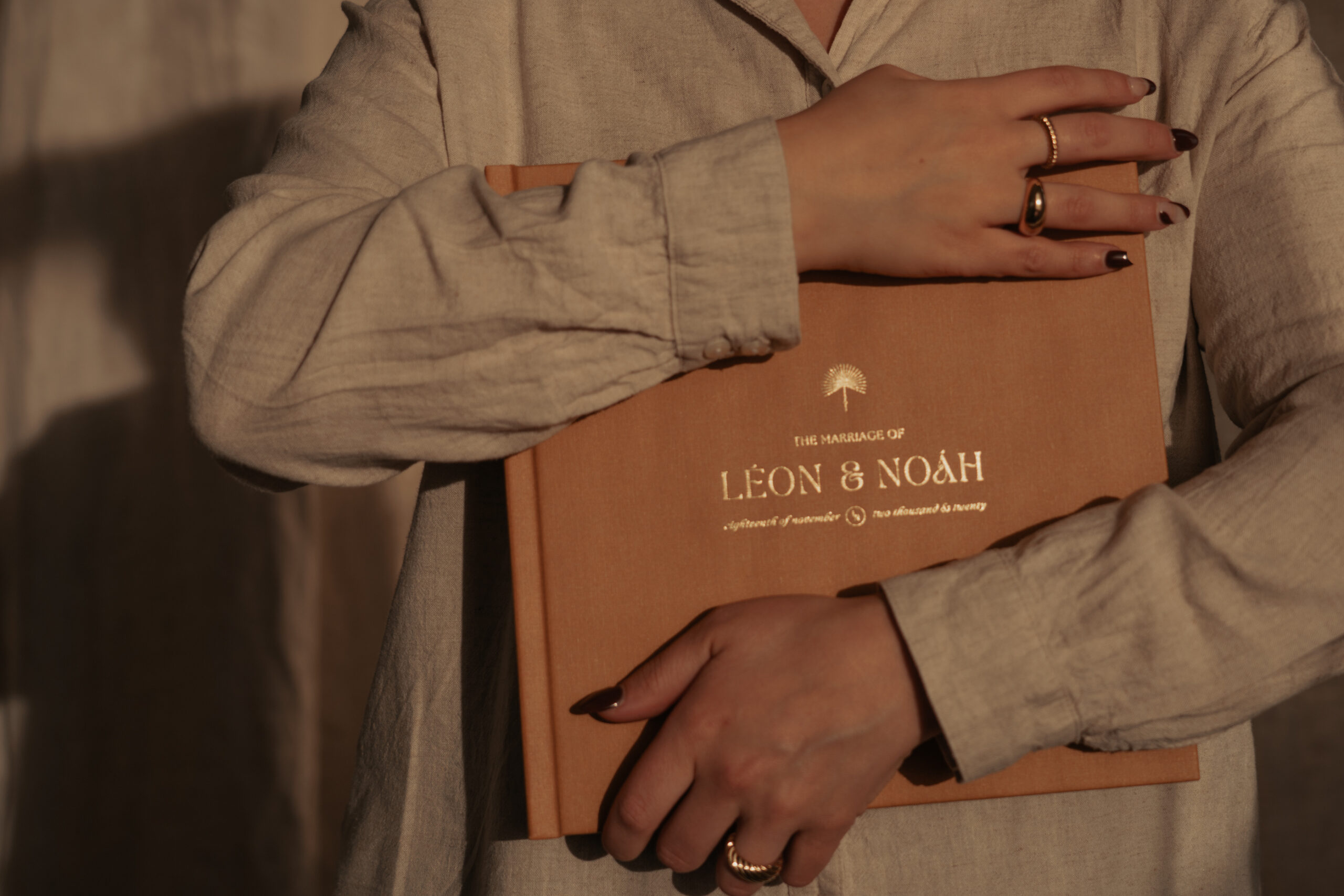 photo of bride holding her printed wedding album